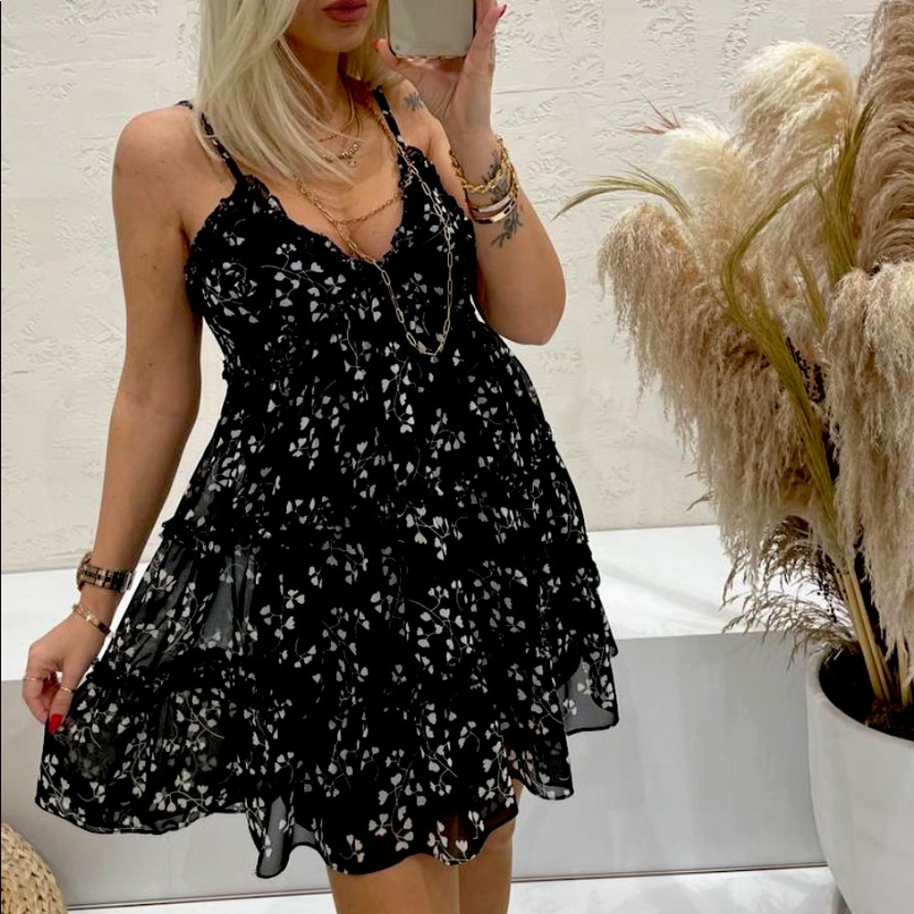 Mini dress, black with white design. Brand new in tag, comes in S,M,and L.